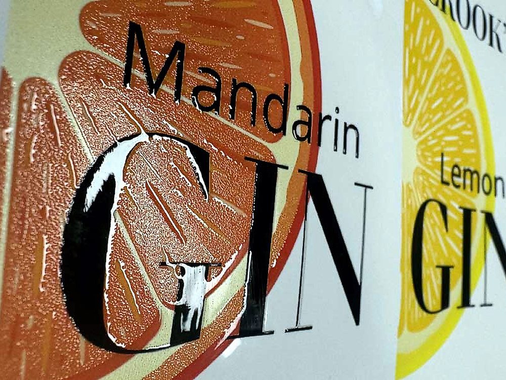A foiled and embossed self-adhesive label in close-up