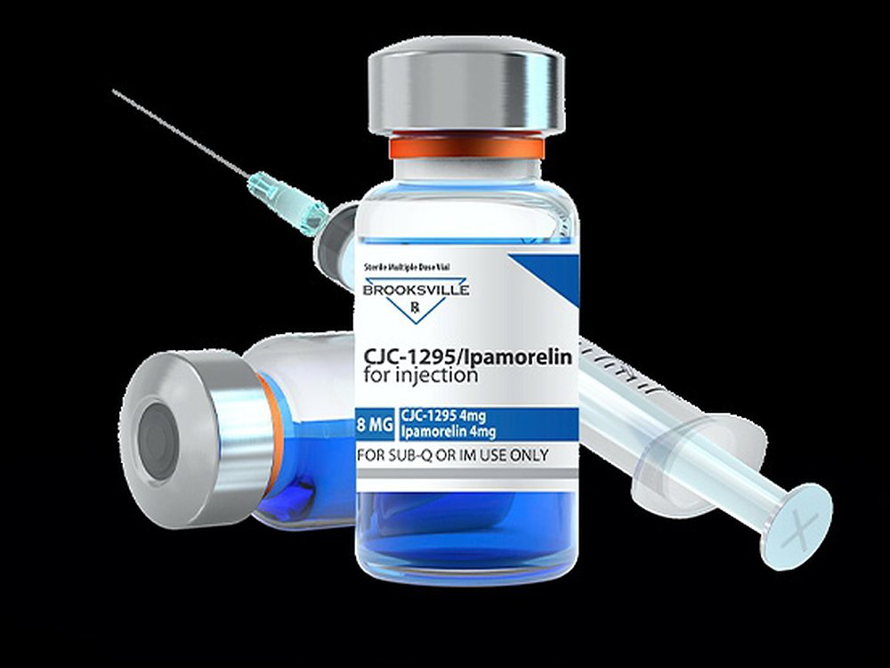 Pharmaceutical vial and syringe carrying a printed label